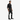 Man wearing a black shirt and black leather pants with white stripes on a white background